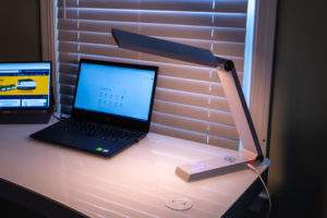 white triangular desk lamp